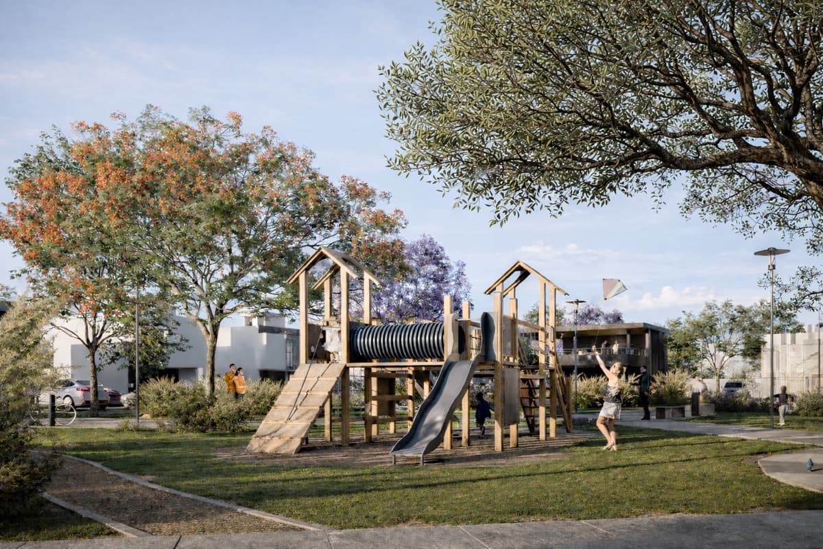Área de juegos infantiles de madera con niños jugando en VERA Residencial